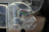 Alexandra really likes making bubbles.