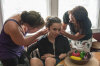 7/8 - Trying to fit some marbles in Emily's ears.